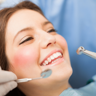 What to expect during your first orthodontic visit at joosse family orthodontics 4 A woman smiling at dentist, representing first orthodontic visit