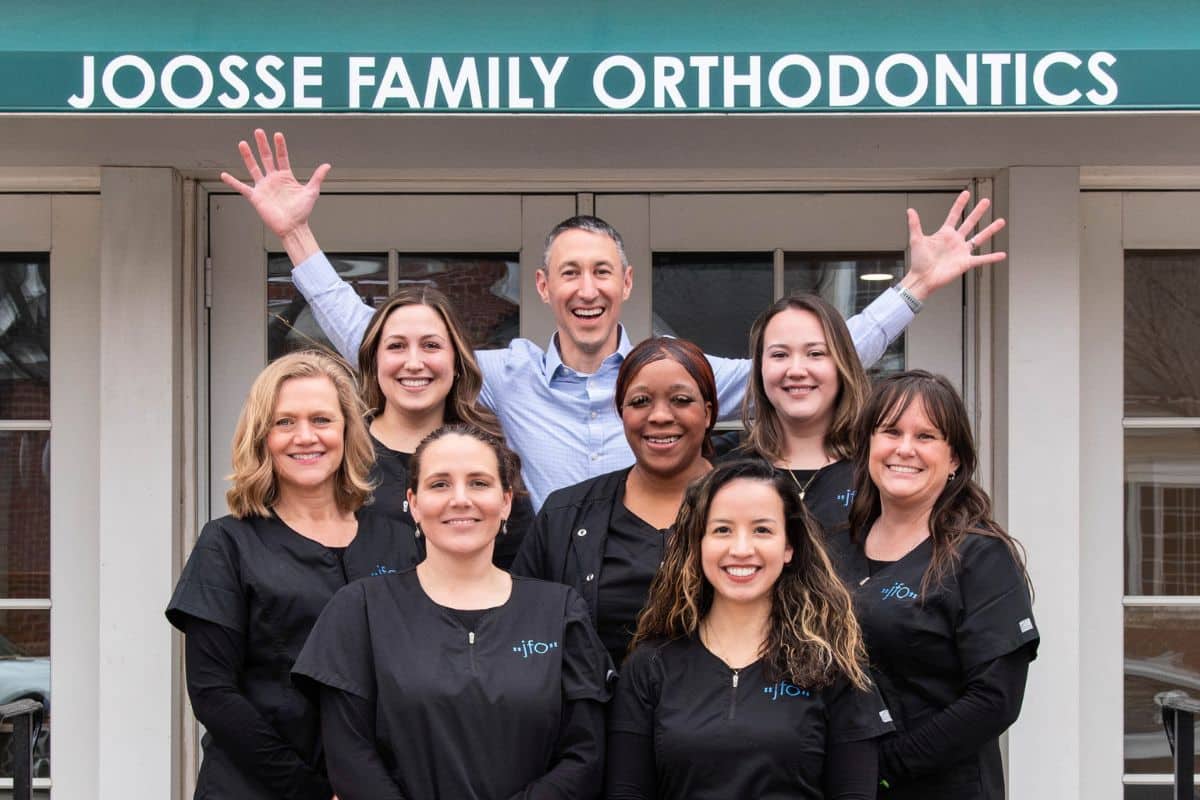 Joosse-family-orthodontics-team-group-photo (3) Joosse family orthodontics team building front arms raised